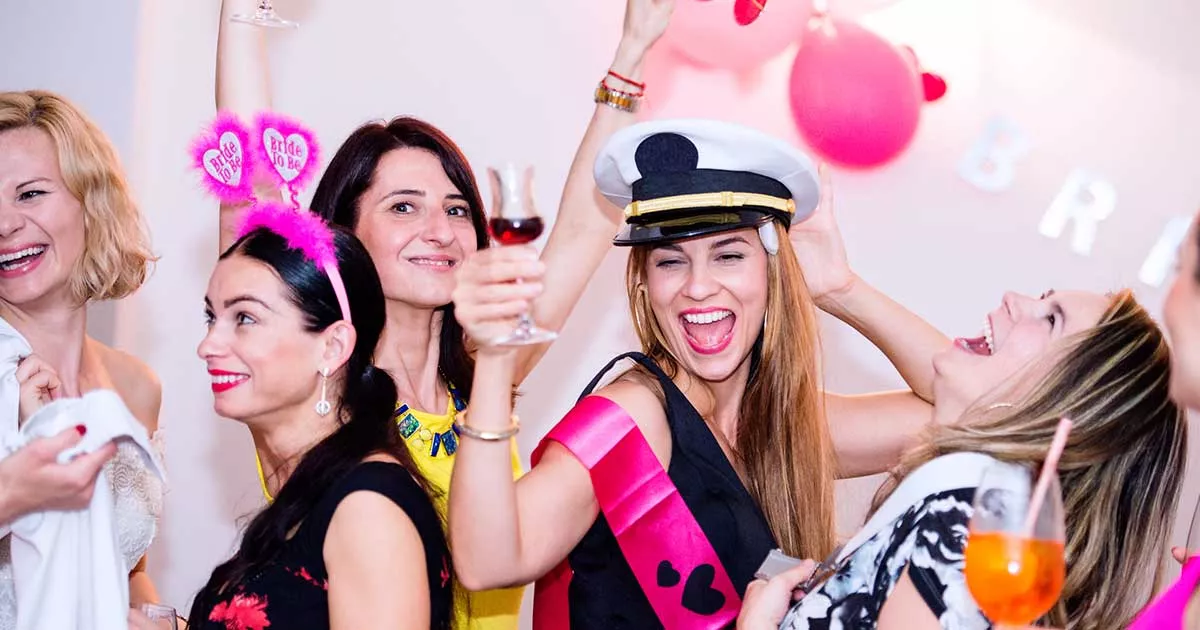Women with various accessories on celebrating hens party